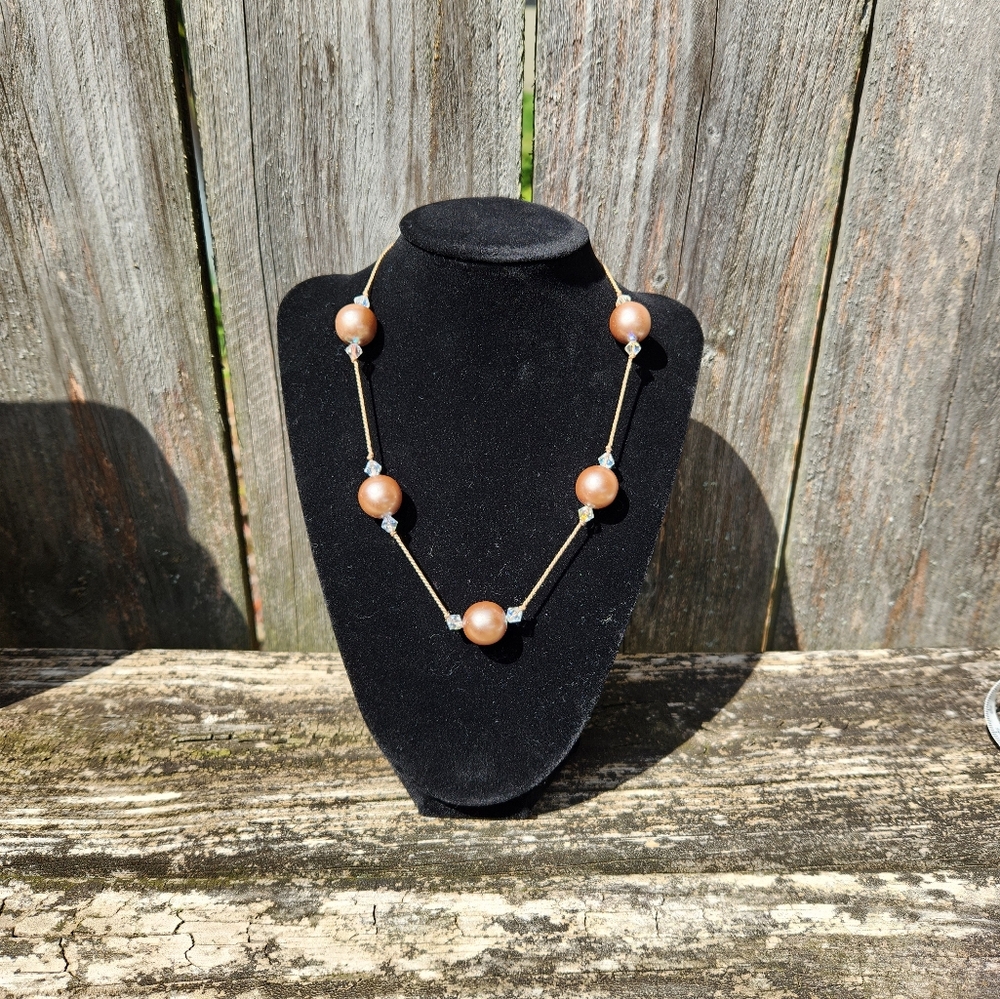 Costume necklace with large pearl like beads